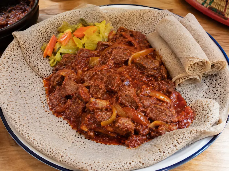 AfroKitchen recipe collection artwork for Zigini with Injera